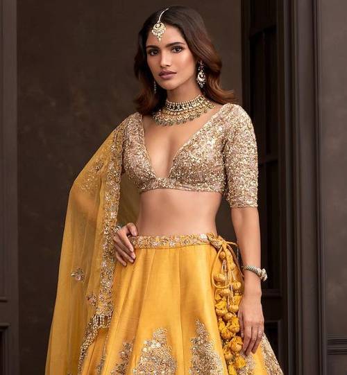 Fine Women's Clothing on Instagram: “Crop top and lehenga !!! Golden lehenga  paired up with coral hand… | Lehenga designs, Saree blouse designs, Sari blouse  designs