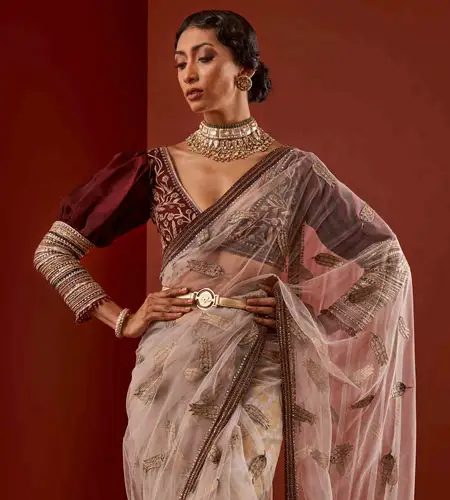 burgundy full sleeve puff blouse paired with pastel pink saree
