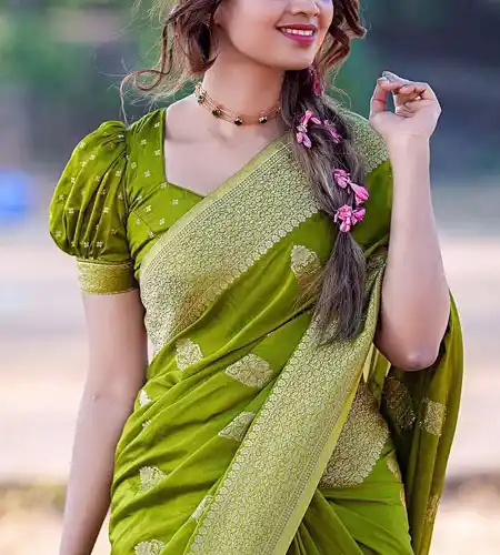 half sleeve mehandi green puff blouse design paired with matching silk saree