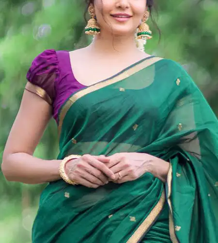 short sleeve purple puff blouse paired with green silk saree