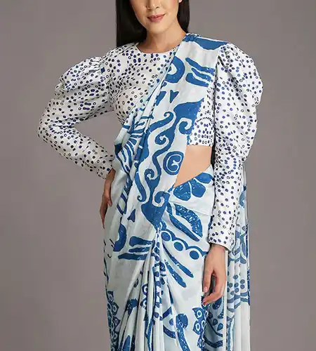 white full sleeve polka print puff blouse paired with matching printed saree