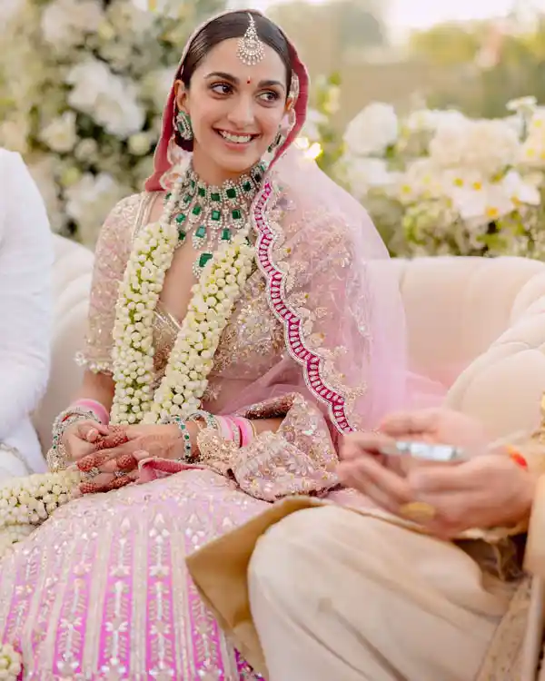 Kiara Advani complemented her pink wedding lehenga with emerald jewelry