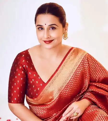 Vidya Balan wears brick orange blouse with matching silk saree