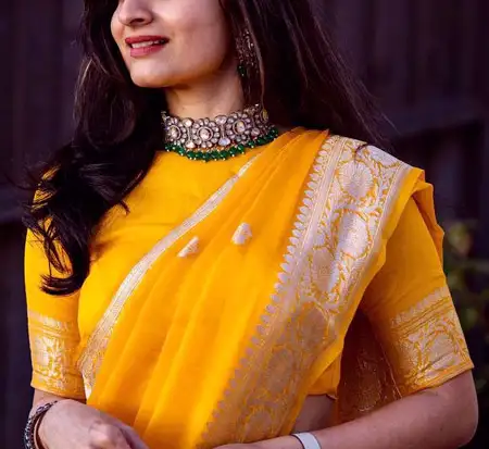 yellow soft silk saree blouse with high neck and elbow sleeve design