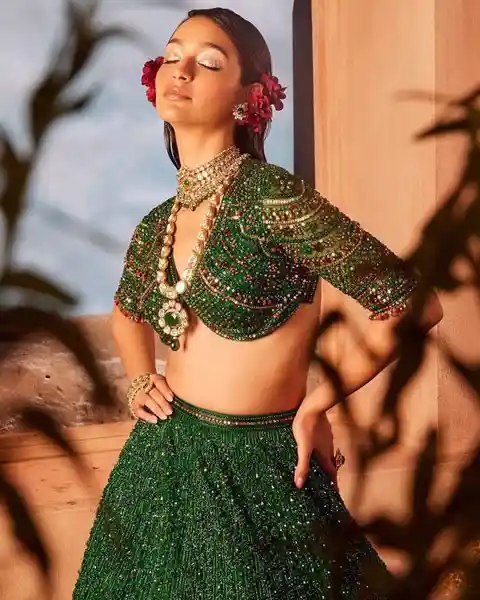 green bead embellished lehenga blouse with butterfly front cut design