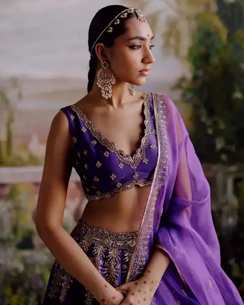 sleeveless purple, gold motifs adorned bridal lehenga blouse design