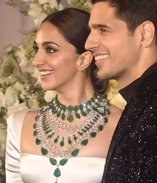 Kiara wore ebony-ivory monochrome gown paired with diamond and emerald layered necklace