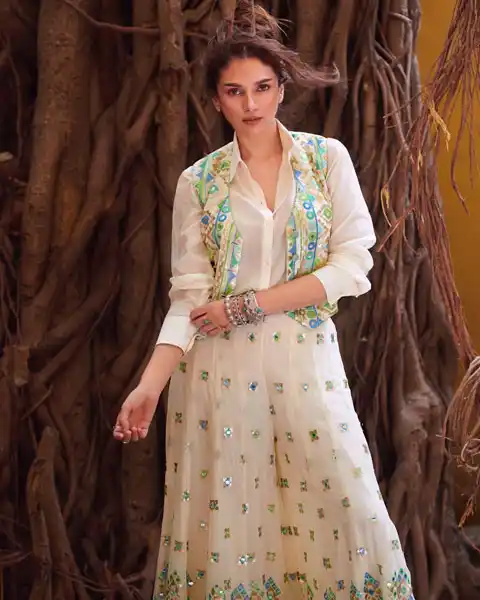 Aditi Rao Hydari wearing flared palazzo with shirt and fancy jacket - perfect Indo-western outfit ideas for festivals..