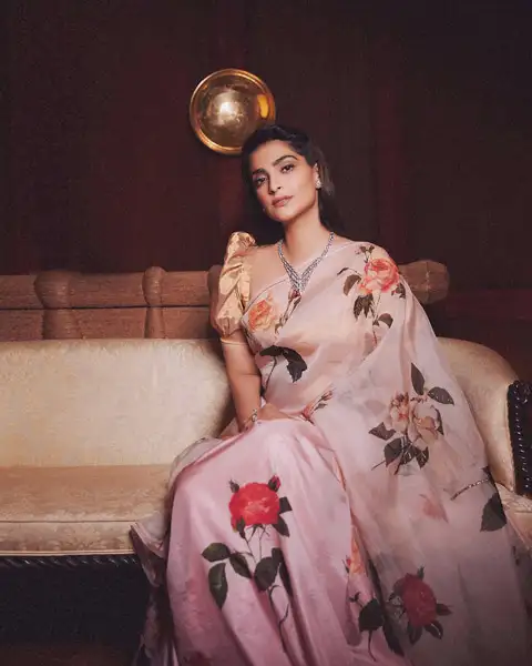 Sonam kapoor wore pastel shade floral saree with gold blouse
