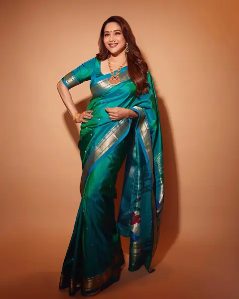 Madhuri in green traditionall silk saree for festive occasion