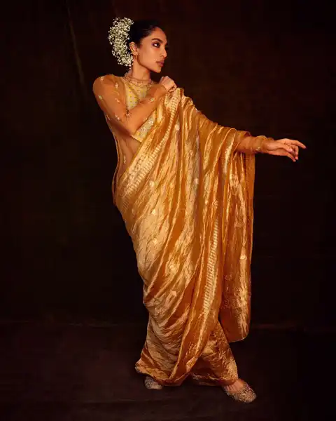 Sobhita wore gold tissue saree with kurta.