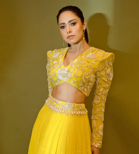 Nushrratt Bharuccha donned plain yellow lehenga with a full-sleeved, V-neck embroidered blouse design