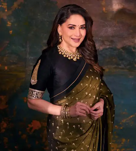 Madhuri Dixit wore mustard saree with a simple black blouse