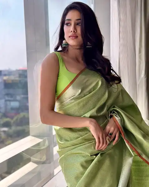 Janhvi Kapoor wears green pastel kanjivaram silk saree with sleeveless blouse